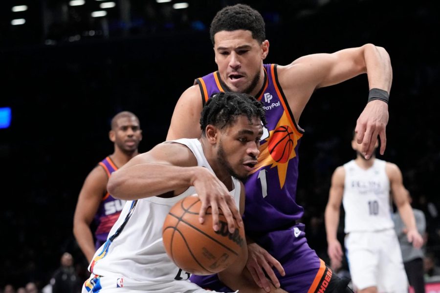 Cam+Thomas+being+guarded+by+Devin+Booker+%28Photo+Courtesy+of+amNewYork%29