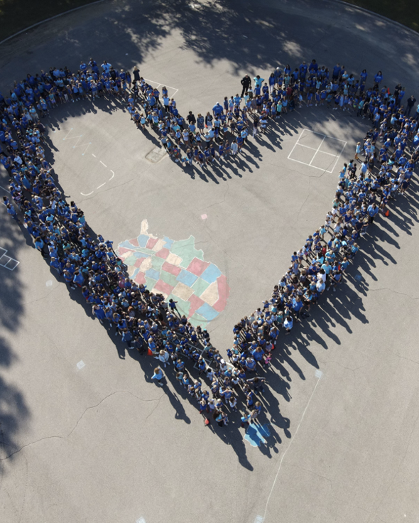 Crosswind students forming a heart after receiving their award.
Photo courtesy of Kristie Murin, principle of Crosswind Elementary School.