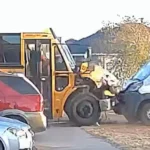 A school bus lying on its side after a crash captured on video