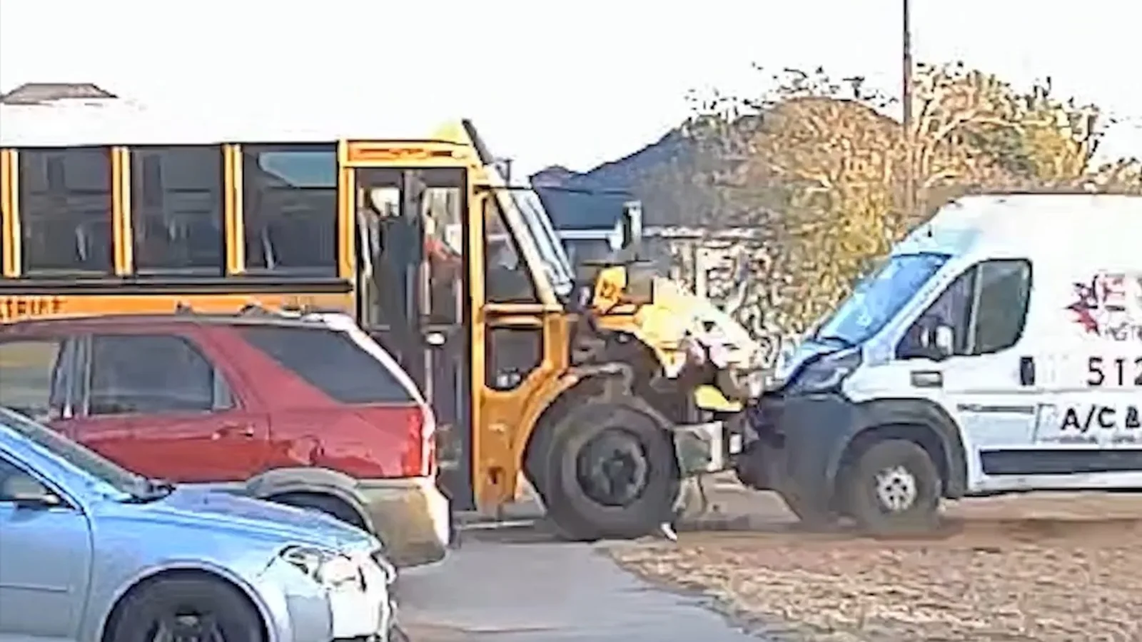 Texas School Bus Crash Captured on Camera Shows Vehicle Tipping Onto Its Side After Hitting Another Vehicle in a Collision That Left Students Shaken