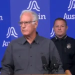 Police and emergency vehicles respond to a shooting scene on Anderson Square in Austin