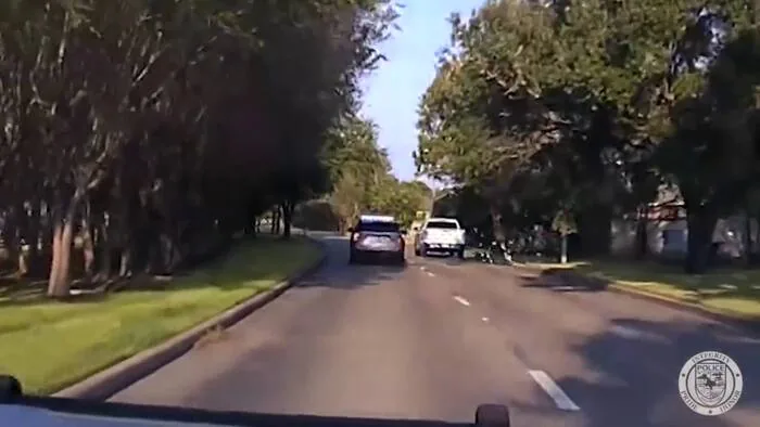 Pearland police vehicle response after a chase involving a white GMC Sierra and cash thrown from the truck