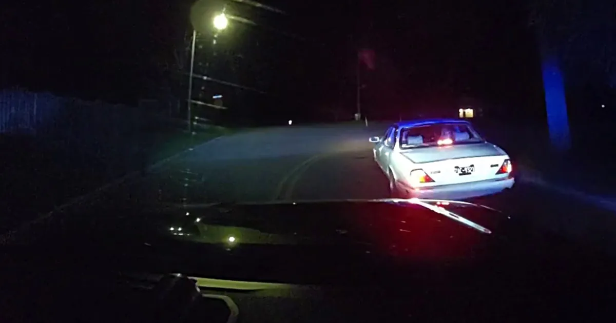 A vehicle sits partly submerged in Lake Como after a police chase in Walworth County